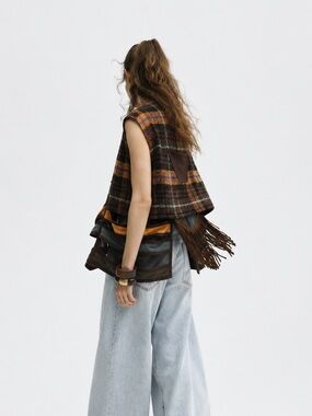 The Louqii Exceptional Quality Nomad Vest with Plaid Fringe and cutout design